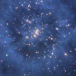 This Hubble Space Telescope composite image shows a ghostly 'ring' of dark matter in the galaxy cluster Cl 0024+17. The ring-like structure is evident in the blue map of the cluster's dark matter distribution.
