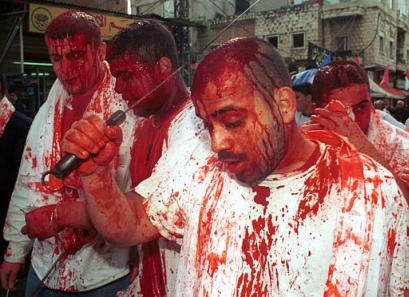 Shiite Muslim men cut their heads with swords during the annual ritual to mark Ashoura Day in the southern Lebanese town of Nabatiyeh, on Thursday March 13, 2003. Hundreds of Shiites in south Lebanon marked the 7th century killing of their most revered saint Imam Hussein, by slashing their heads with blades on the occasion known as Ashoura. Al Hussein was a grandson of Islam's Prophet Mohammed and is a symbol of martydrom for Shiite Muslims.